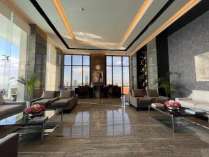 Area soggiorno di Hotel A and A Quezon City powered by Cocotel