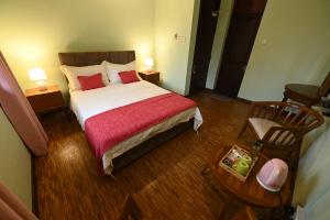 Postel nebo postele na pokoji v ubytování Serene Manor
