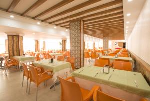 a dining room with tables and chairs in a restaurant at Side Resort Annex - All Inclusive in Side