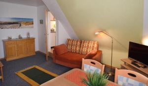 Posezení v ubytování Wohnung Dünenstübchen, Haus Seeadler Baltrum + 9 fotografií