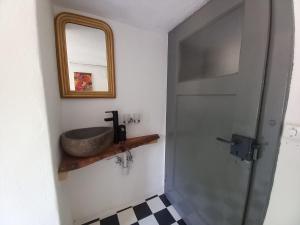 a bathroom with a sink and a mirror at Room in Apartment - Casa Coerente Cavergno Room no 4 in Cevio