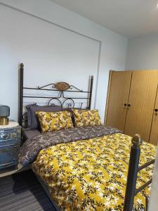 A bed or beds in a room at Polys Apartment and Paraskevi studio with view