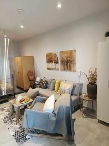 A seating area at Polys Apartment and Paraskevi studio with view