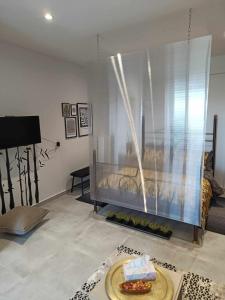 A bed or beds in a room at Polys Apartment and Paraskevi studio with view