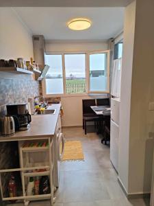 A kitchen or kitchenette at Polys Apartment and Paraskevi studio with view