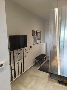 A television and/or entertainment centre at Polys Apartment and Paraskevi studio with view