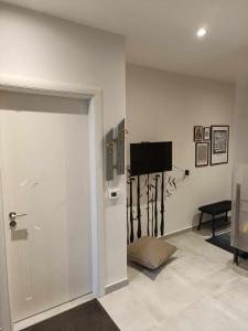 A television and/or entertainment centre at Polys Apartment and Paraskevi studio with view