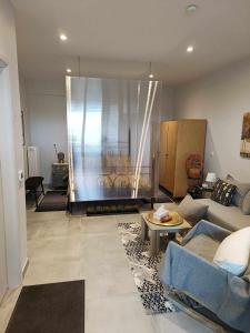 A seating area at Polys Apartment and Paraskevi studio with view