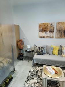 A seating area at Polys Apartment and Paraskevi studio with view