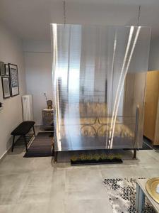 A bed or beds in a room at Polys Apartment and Paraskevi studio with view