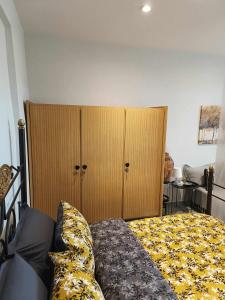 A bed or beds in a room at Polys Apartment and Paraskevi studio with view