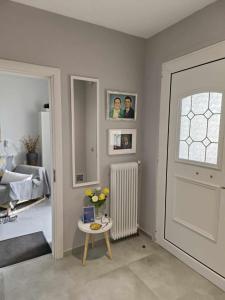 A bed or beds in a room at Polys Apartment and Paraskevi studio with view