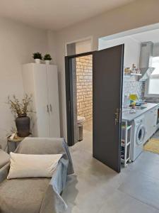 A kitchen or kitchenette at Polys Apartment and Paraskevi studio with view