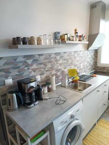 A kitchen or kitchenette at Polys Apartment and Paraskevi studio with view