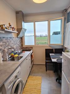 A kitchen or kitchenette at Polys Apartment and Paraskevi studio with view