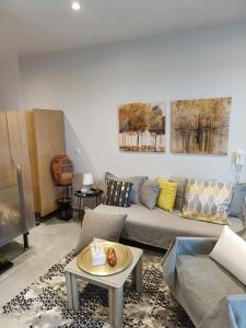 A seating area at Polys Apartment and Paraskevi studio with view