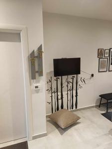 A television and/or entertainment centre at Polys Apartment and Paraskevi studio with view