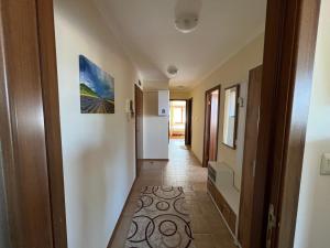 a corridor of a room with a hallway at VV Apartment Bansko in Bansko