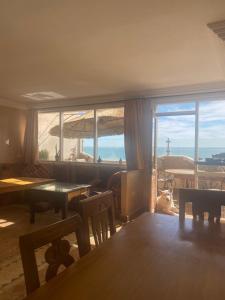 a living room with a view of the ocean at Dar Rio Oro in Dakhla