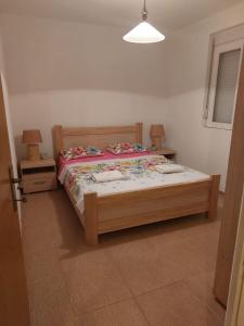 Postel nebo postele na pokoji v ubytování Apartmani “Dunja”