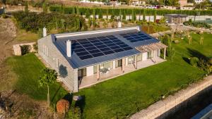 an aerial view of a house with solar panels on the lawn at Eco complex Zdravets in Zdravets