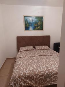 Postel nebo postele na pokoji v ubytování Apartmani “Dunja”