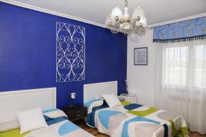 A bed or beds in a room at Casa los Arcos
