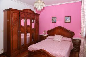 A bed or beds in a room at Casa los Arcos