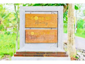 a sign that says going wickingicking going nihiorthy at Gongwi Cottages Sidemen in Sidemen