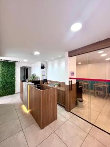 a lobby of a hospital with a reception counter at Mirante dos Corais in Porto De Galinhas