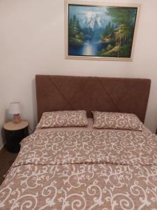 Postel nebo postele na pokoji v ubytování Apartmani “Dunja”