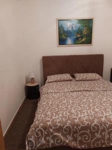 Postel nebo postele na pokoji v ubytování Apartmani “Dunja”
