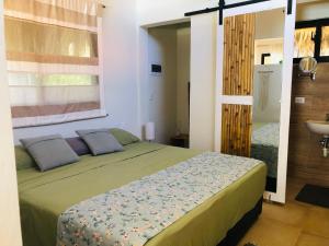 Postel nebo postele na pokoji v ubytování Sfeervolle studio in Encuentro Cabarete