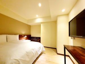 Ein Bett oder Betten in einem Zimmer der Unterkunft Just live inn - New Dahua