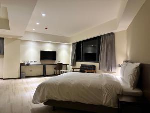 Ein Bett oder Betten in einem Zimmer der Unterkunft Just live inn - New Dahua