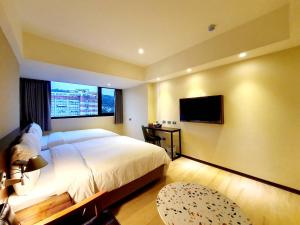 Ein Bett oder Betten in einem Zimmer der Unterkunft Just live inn - New Dahua
