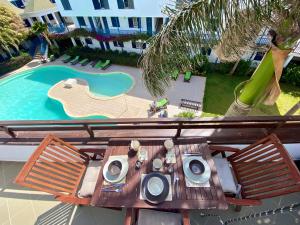 an overhead view of a table and a swimming pool at Leme Bedje - Two bedroom, Pool & Wifi in Santa Maria