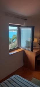 Postel nebo postele na pokoji v ubytování APARTMANI SENKA - VILLA OLIVER