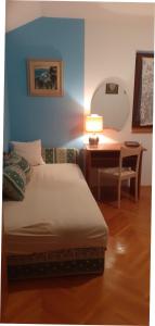 Postel nebo postele na pokoji v ubytování APARTMANI SENKA - VILLA OLIVER