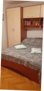 Postel nebo postele na pokoji v ubytování APARTMANI SENKA - VILLA OLIVER