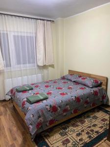 Ένα ή περισσότερα κρεβάτια σε δωμάτιο στο Apartament ultracentral Botis