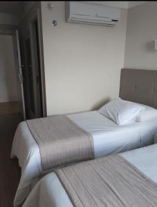 Кровать или кровати в номере QUARTO DUPLO - Suíte