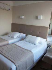Кровать или кровати в номере QUARTO DUPLO - Suíte
