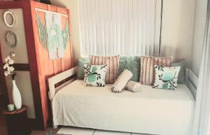 a room with a bed with pillows on it at Stay on Lane in Swellendam