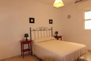 Posteľ alebo postele v izbe v ubytovaní Apartamento Paola