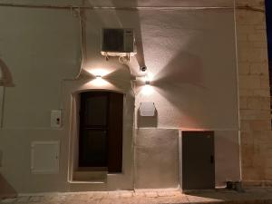 a corner of a building with a tv on the wall at Pietra Antica Luxury in Sannicandro di Bari