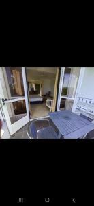 a view of a room with a bed on a balcony at Tam Studio in La Gaulette