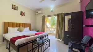 Postel nebo postele na pokoji v ubytování Hotel Leela Inn Candolim + 37 fotografií
