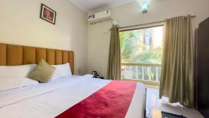 Postel nebo postele na pokoji v ubytování Hotel Leela Inn Candolim