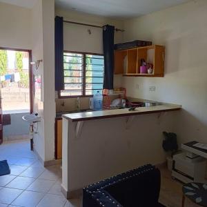 a kitchen with a counter top in a room at Avril's studio apartment in Mombasa